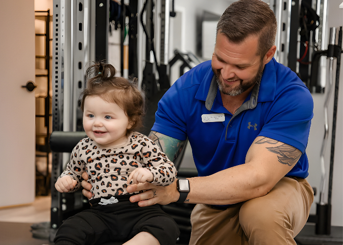 Zacharie-with-baby-enhanced-family-physio-dalton-ga